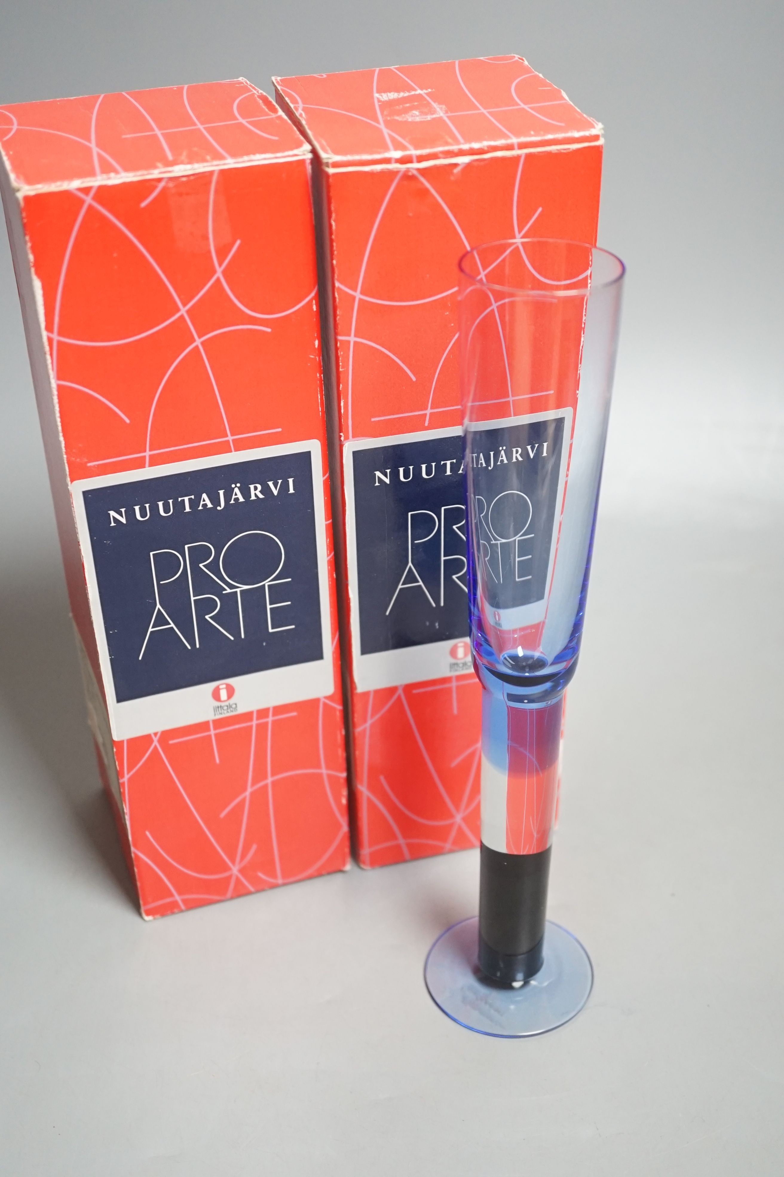 A pair of Ittala Lampi champagne flutes. Kerttu Nurminen for 200th Nuutajarvi anniversary - 25cm tall